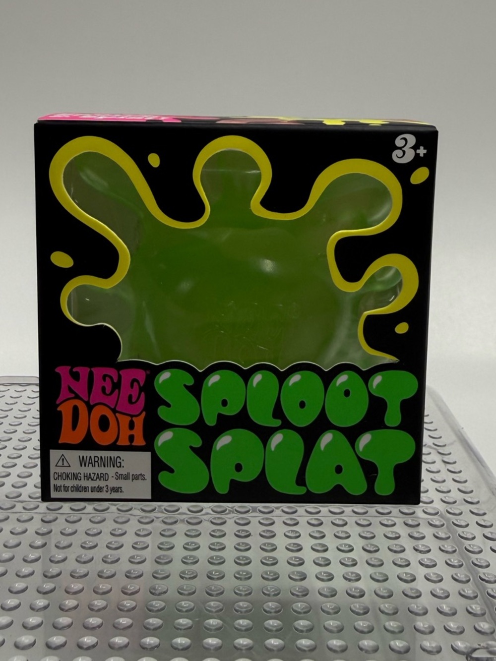 Green NeeDoh sploot splat